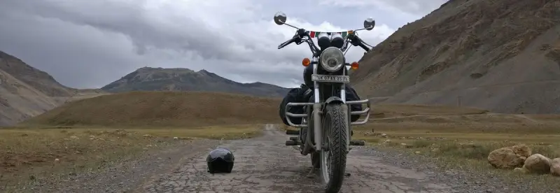 An adventure bike in a remote mountain landscape
