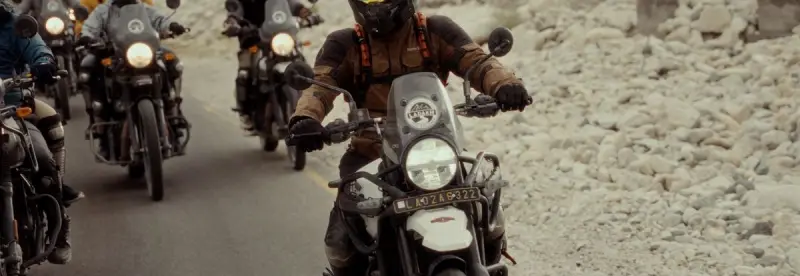 A group of riders on a rocky road