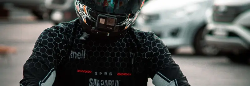 A rider on a green sports bike