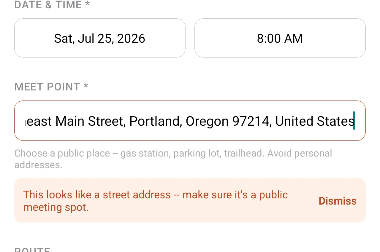 Meet point field in 2 Wheels in Common flagging a selected address as a street address and suggesting a public meeting spot instead